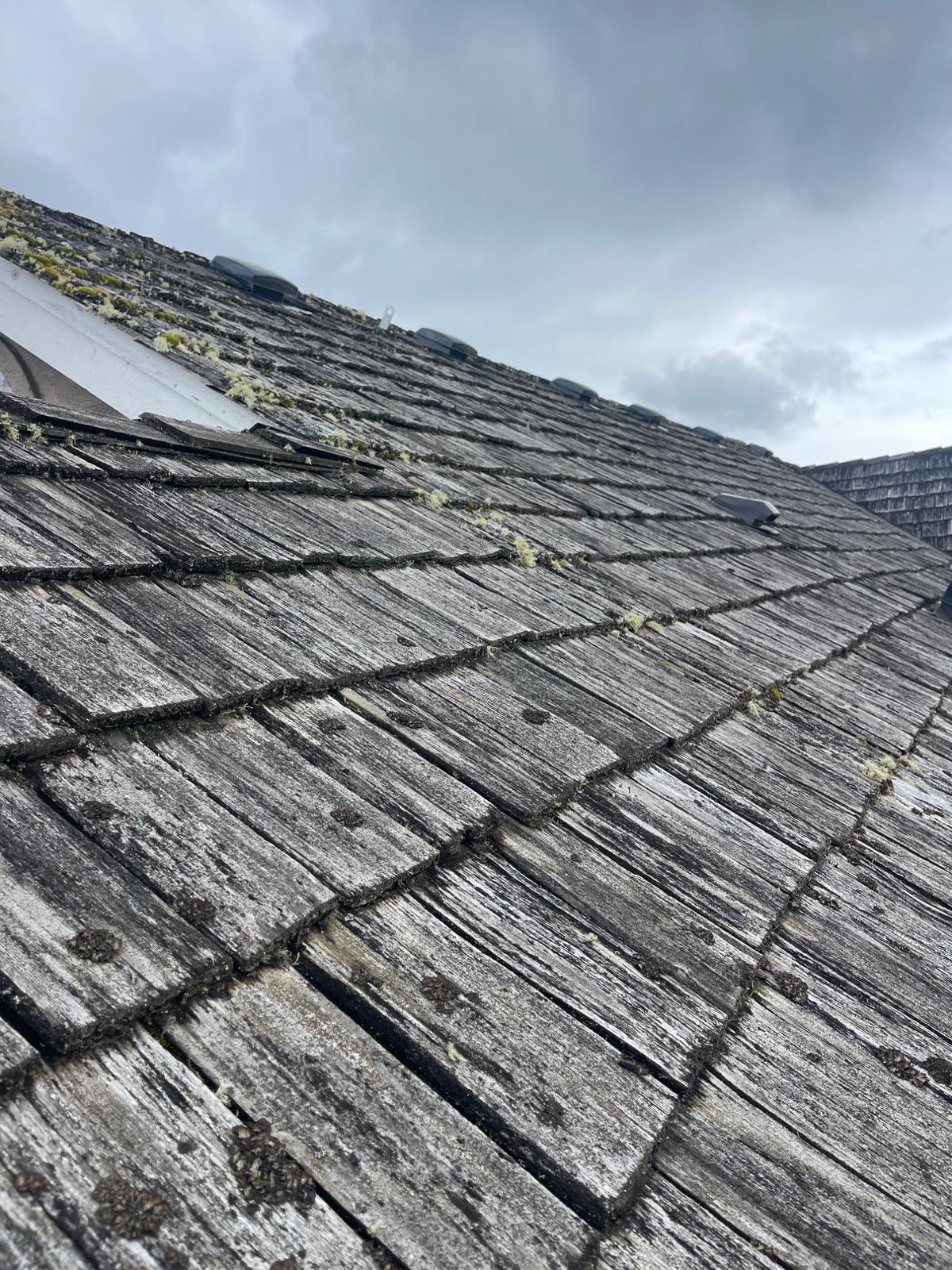 Roofing contractor working on a Auburn home - Mass and Mass LLC